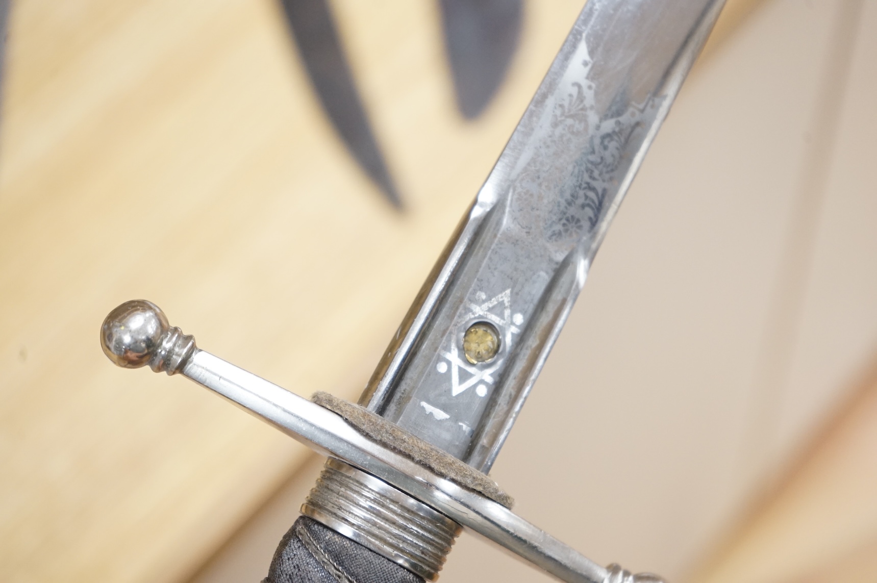 World War I Scottish infantry officer’s undress sword, etched and polished regulation blade with crowned GVR cipher and regulation cruciform hilt, in its leather scabbard